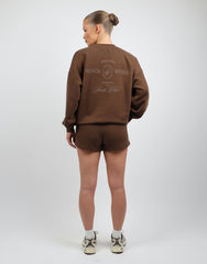 Cove Simmi Studios Embroidered Logo Sweatshirt In Brown