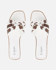 Jorja Cow Print Slip On Flat Sandals